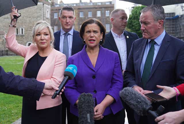 Sinn Fein vice president Michelle O’Neill, Sinn Fein’s president Mary Lou McDonald and Conor Murphy speaking to the media outside the Palace of Westminster in London (PA)