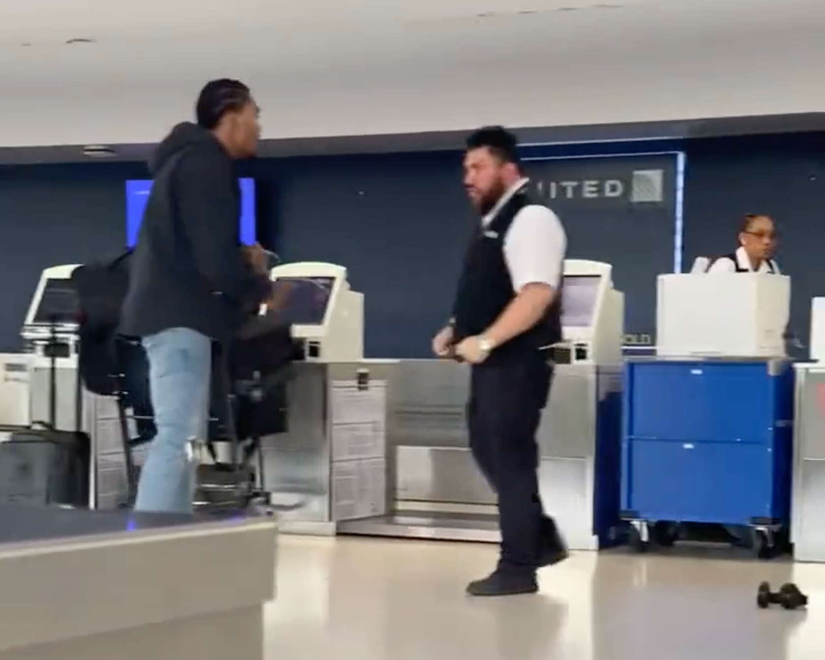 A viral video shows a United Airlines employee in a fistfight with former NFL player Brendan Langley