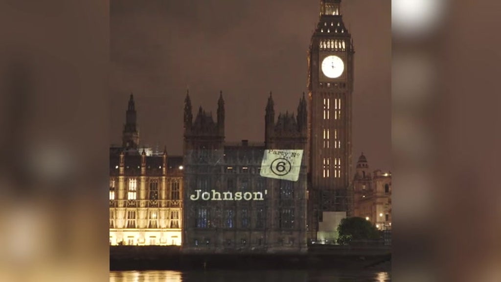 Led By Donkeys project Partygate timeline onto Houses of Parliament