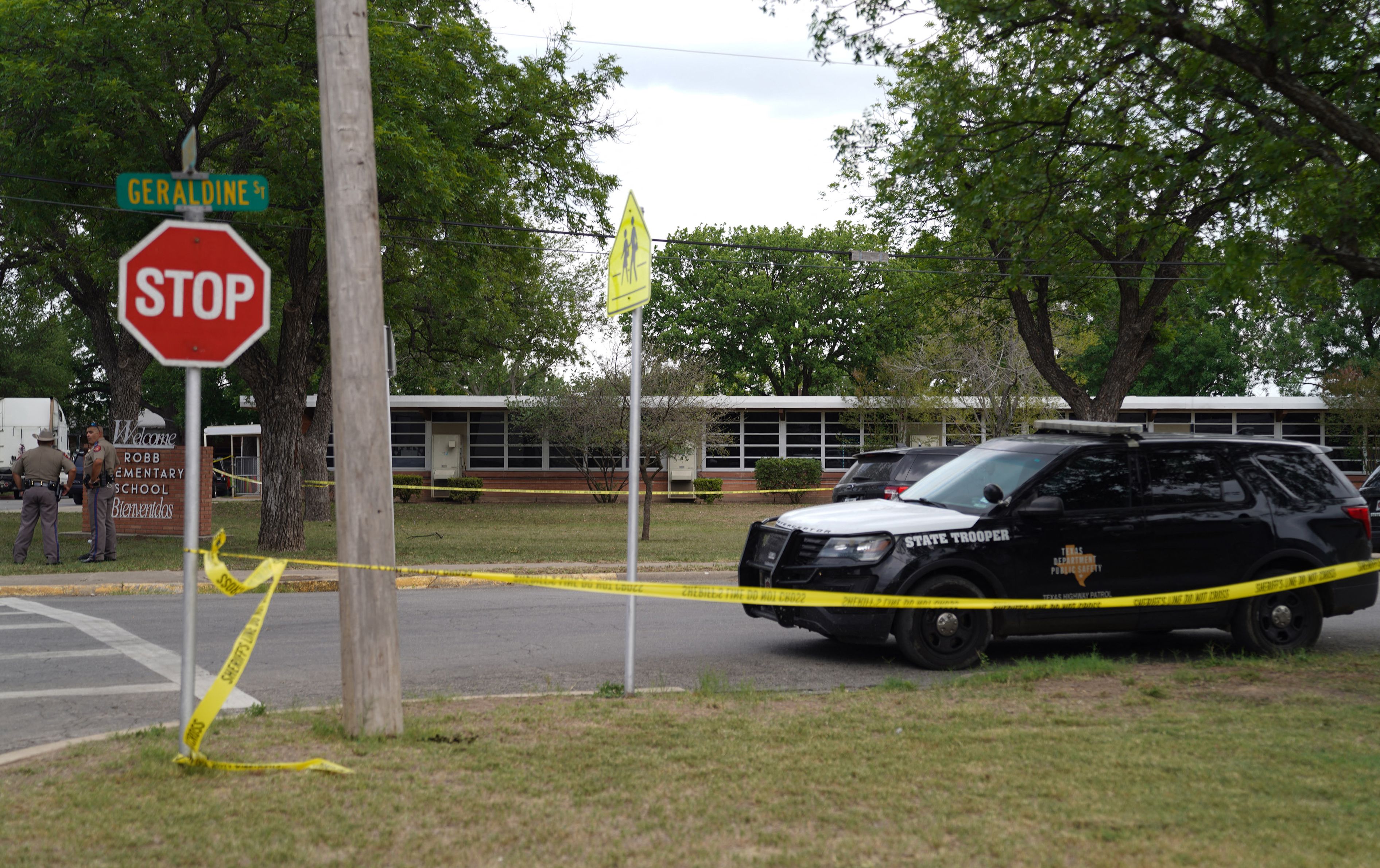 Sheriff crime scene tape is seen outside of Robb Elementary School as State troopers guard the area in Uvalde, Texas, on May 24, 2022.