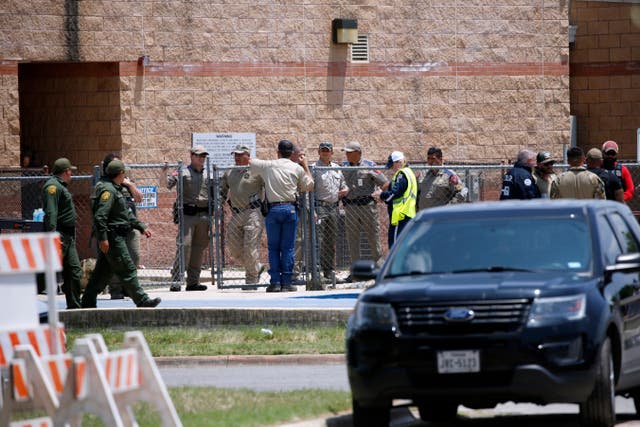<p>Law enforcement, and other first responders, gather outside Robb Elementary School following a shooting, Tuesday</p>