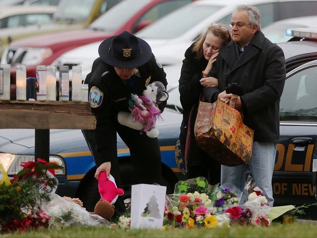 <p>Mourners gather following the Sandy Hook school shooting</p>