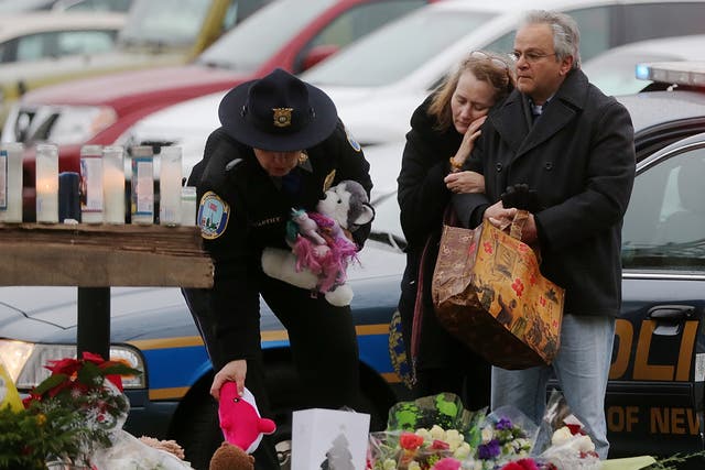 <p>Mourners gather following the Sandy Hook school shooting</p>
