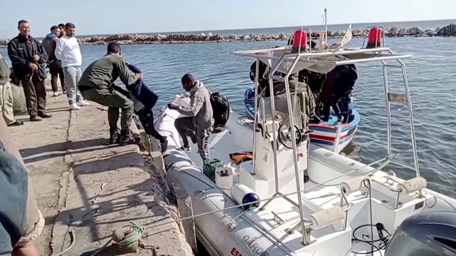 <p>File photo: The Tunisian national coastguard helps a child to get off a rescue boat in Sfax </p>