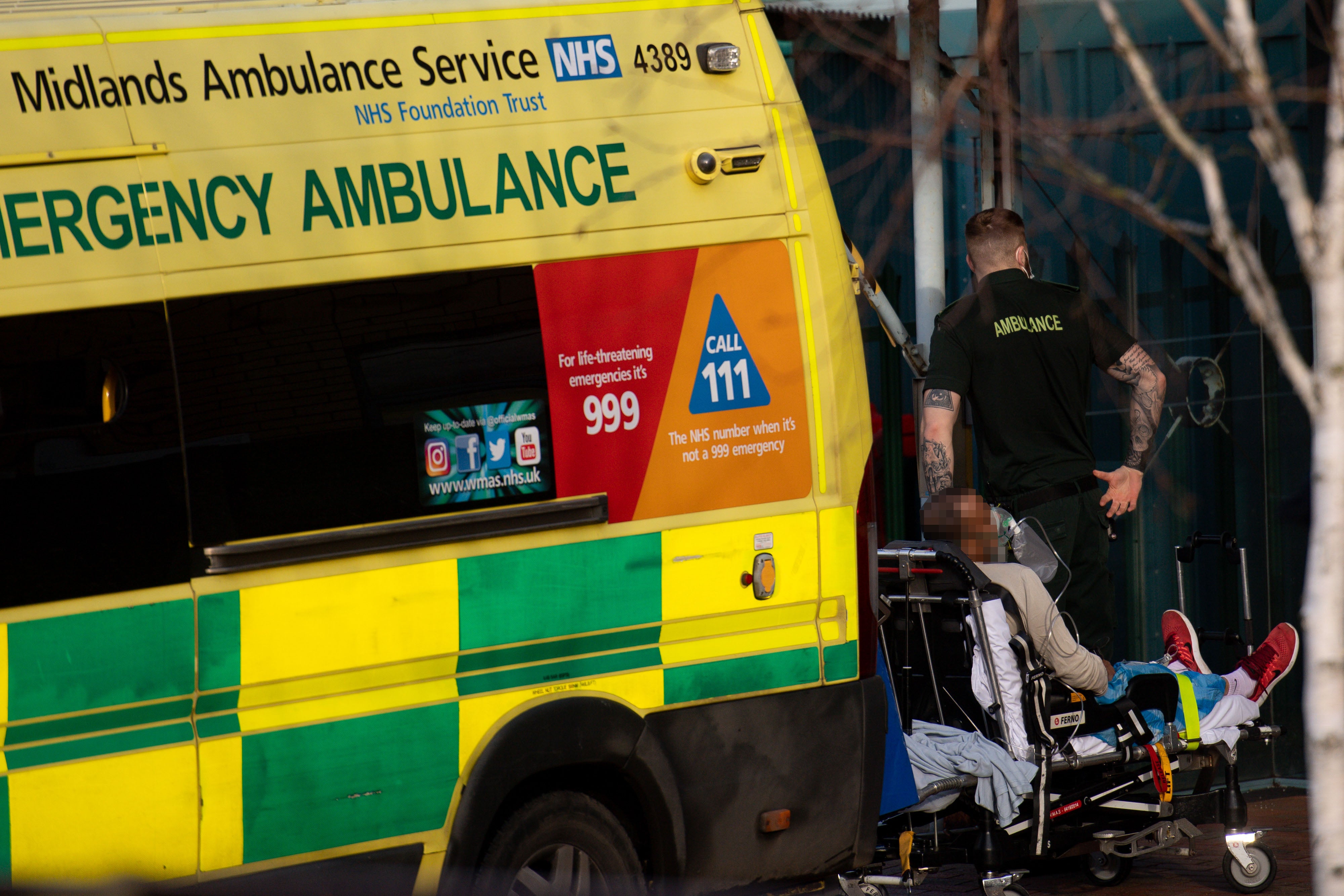 Ambulance crews transport patients into City Hospital in Birmingham (PA)