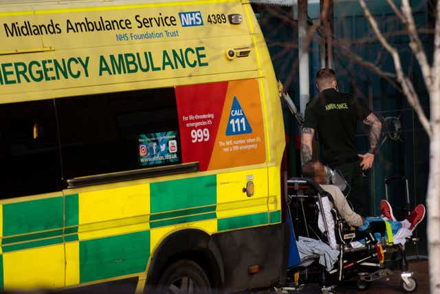 Ambulance crews transport patients into City Hospital in Birmingham (PA)
