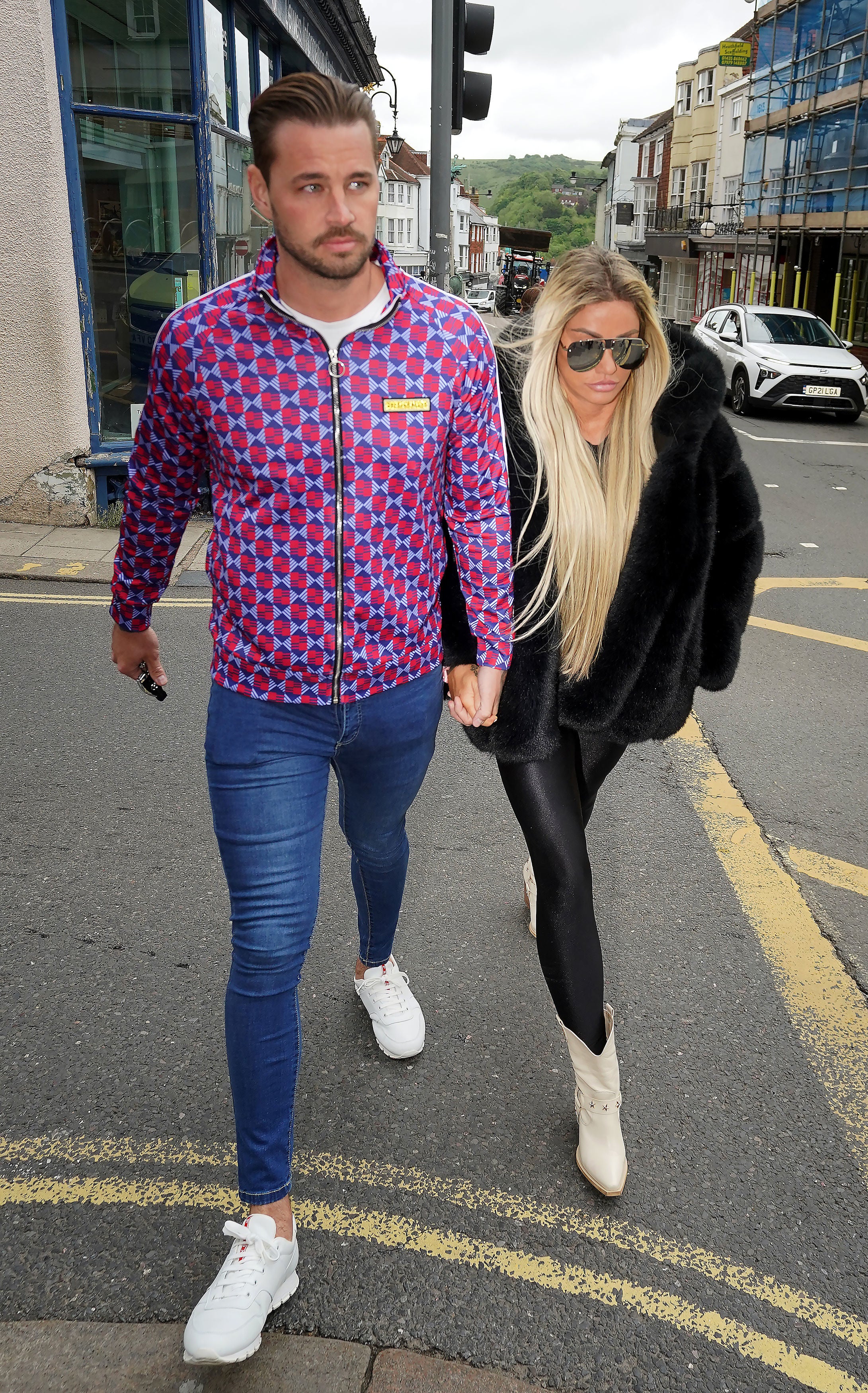 Former glamour model was supported by her reality TV star fiance Carl Woods in court