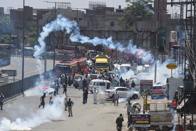 <p>Police use teargas to disperse activists during a protest in Lahore as all roads leading into Pakistan's capital were blocked</p>