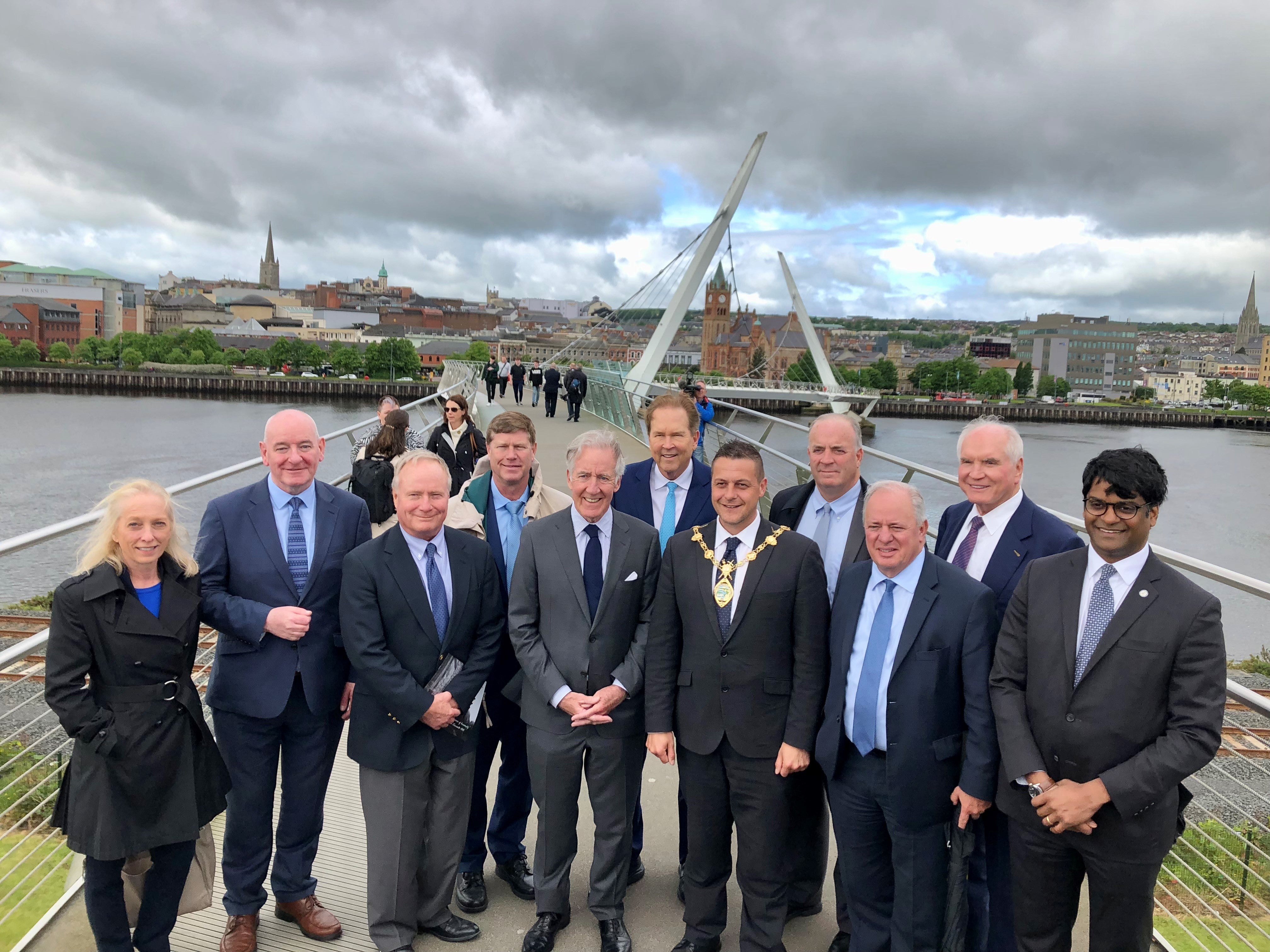 Congressman Richard Neal (centre) with mayor of Derry city and Strabane Graham Warke (third right) on the Peace Bridge (David Young/PA)