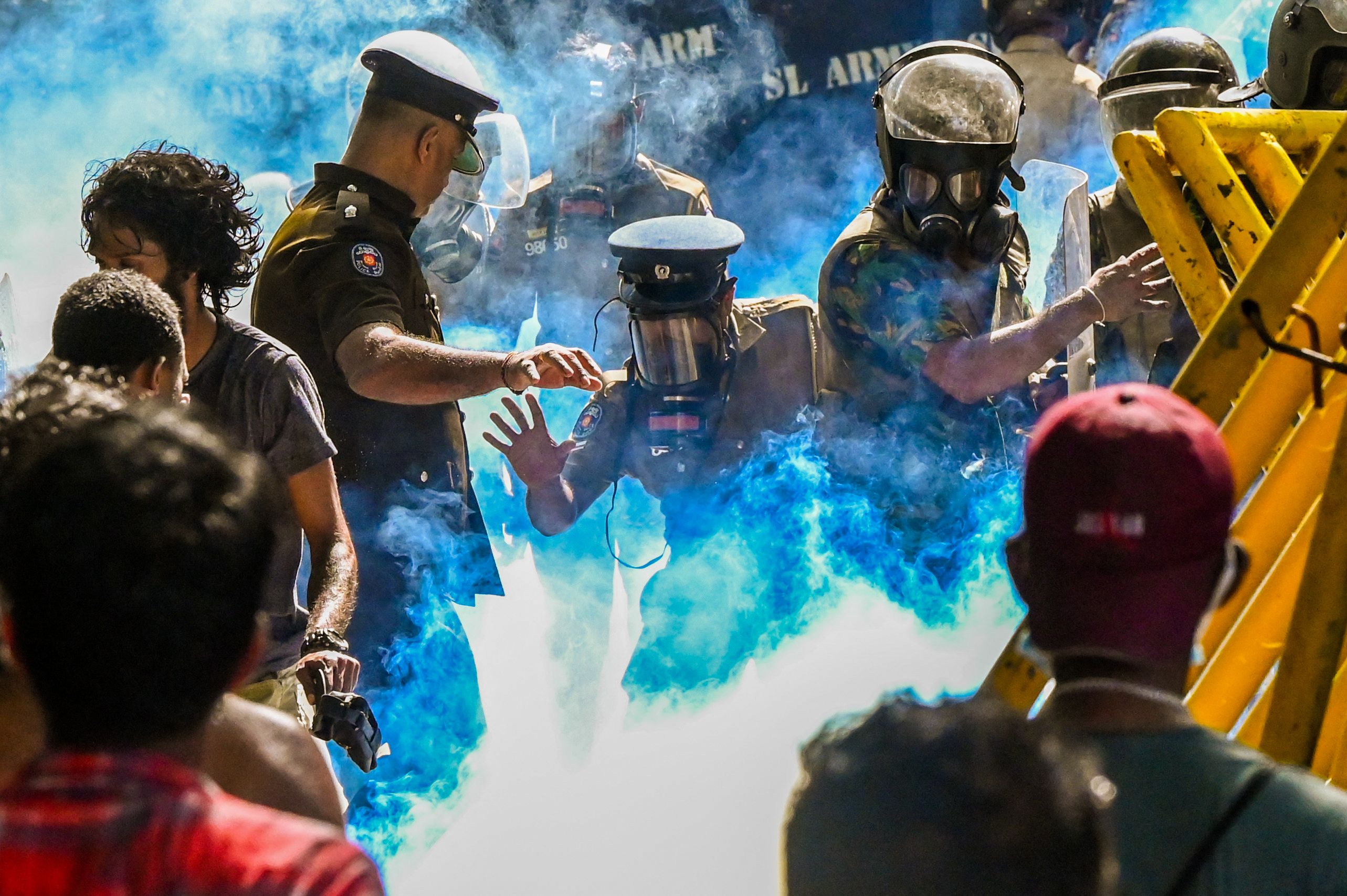 Police use tear gas to disperse students demanding the resignation of Sri Lankan president Gotabaya Rajapaksa over the country’s crippling economic crisis in Colombo on 21 May