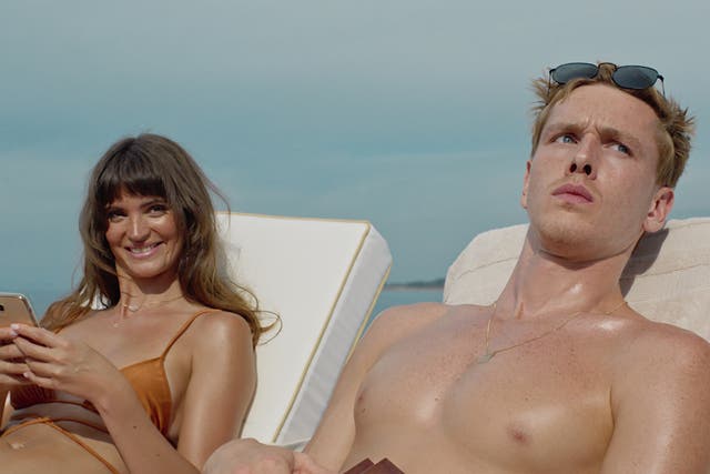 <p>Harris Dickinson as aspiring model Carl and Charlbi Dean as Yaya, his influencer girlfriend, who end up on a luxury cruise with billionaires in Cannes hit ‘Triangle of Sadness’ </p>