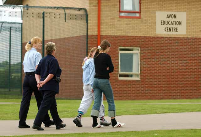 Young offenders are escorted by staff at now-closed Rainsbrook Secure Training Centre, Willoughby (Rui Vieira/PA)