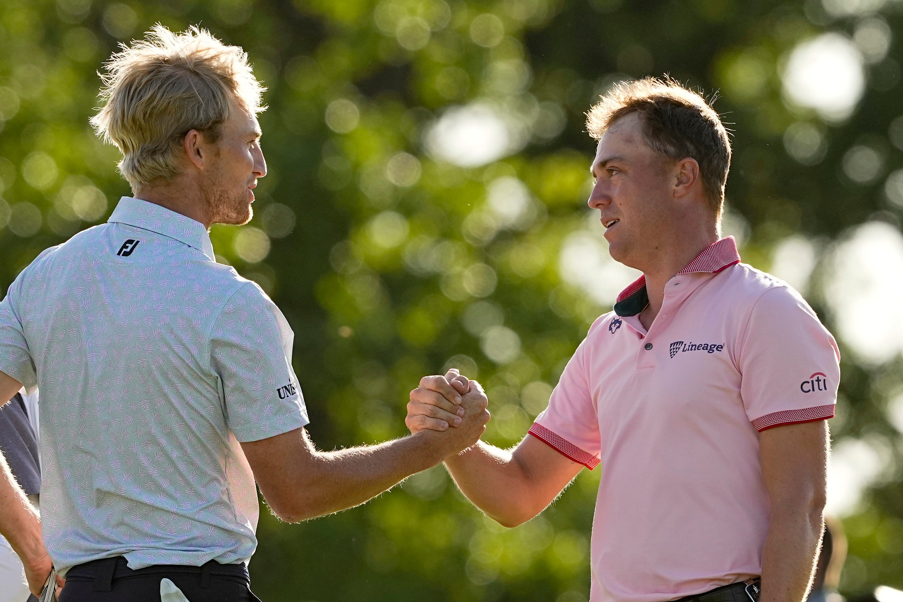 Justin Thomas is greeted by Will Zalatoris after winning their play-off for the US PGA Championship (Matt York/AP)