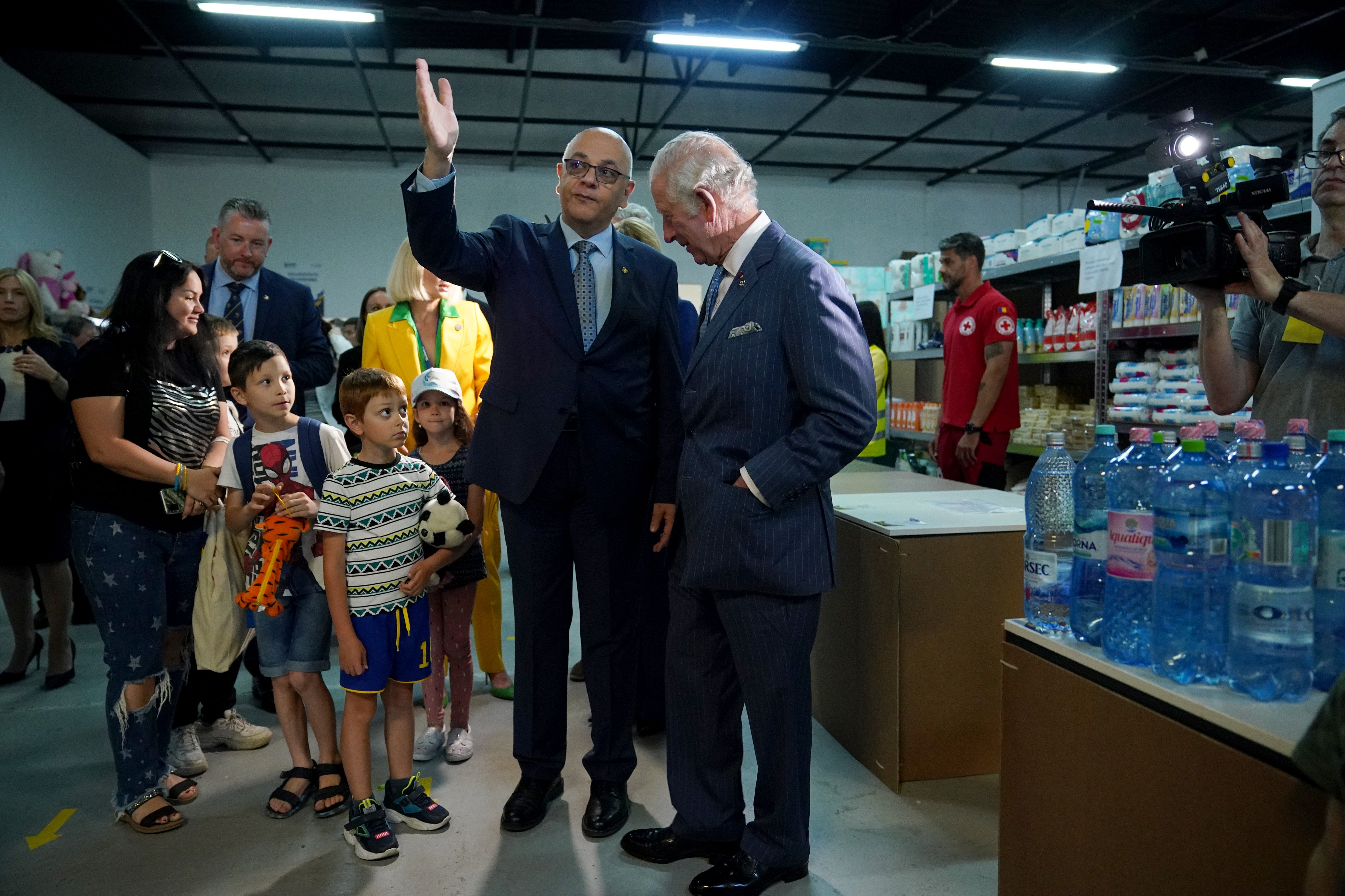 Charles meets officials and refugees at the centre (Yui Mok/PA)