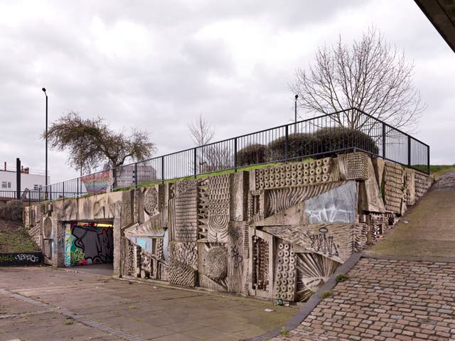 The murals in the pedestrian concourse of Hockley flyover in Birmingham, by sculptor William Mitchell, have been given listed status (Historic England/ PA)