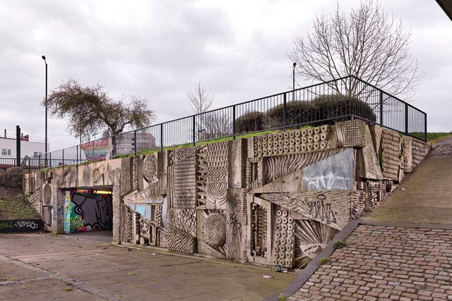 The murals in the pedestrian concourse of Hockley flyover in Birmingham, by sculptor William Mitchell, have been given listed status (Historic England/ PA)