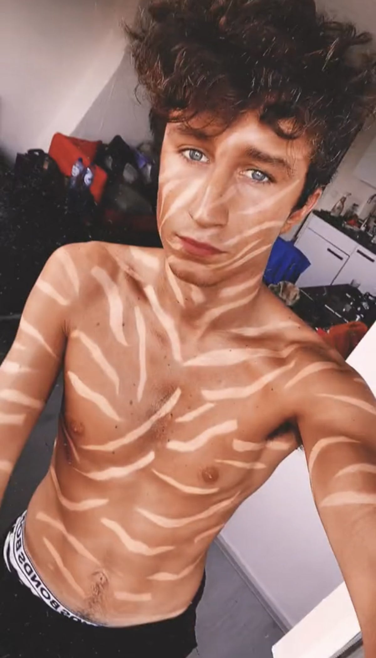 teen boy tanned How to become TikTok famous: Struggling musician clocks 20 million views  after covering himself in a 'zebra tan' | The Independent