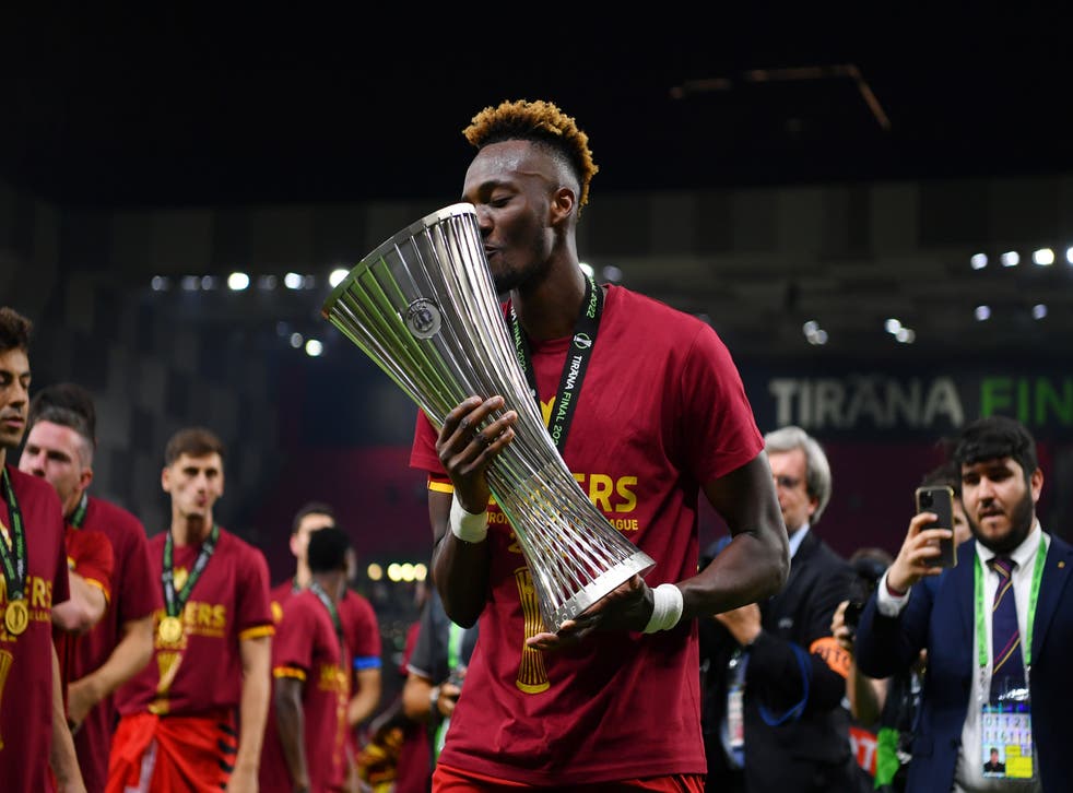 <p>Tammy Abraham of AS Roma celebrates with the UEFA Europa Conference League Trophy</p>