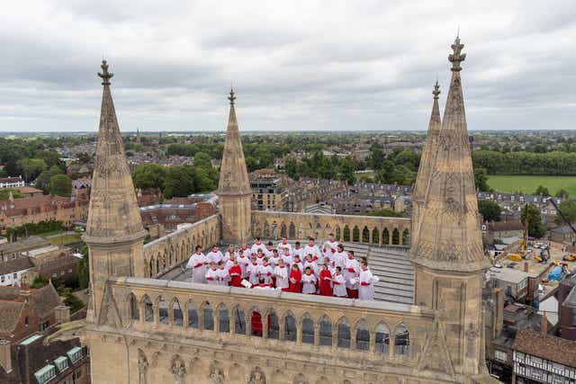 A choir sang from the rooftop of St Johns Chapel tower in Cambridge to mark Ascension Day, continuing a tradition that dates back to 1902 (PA)