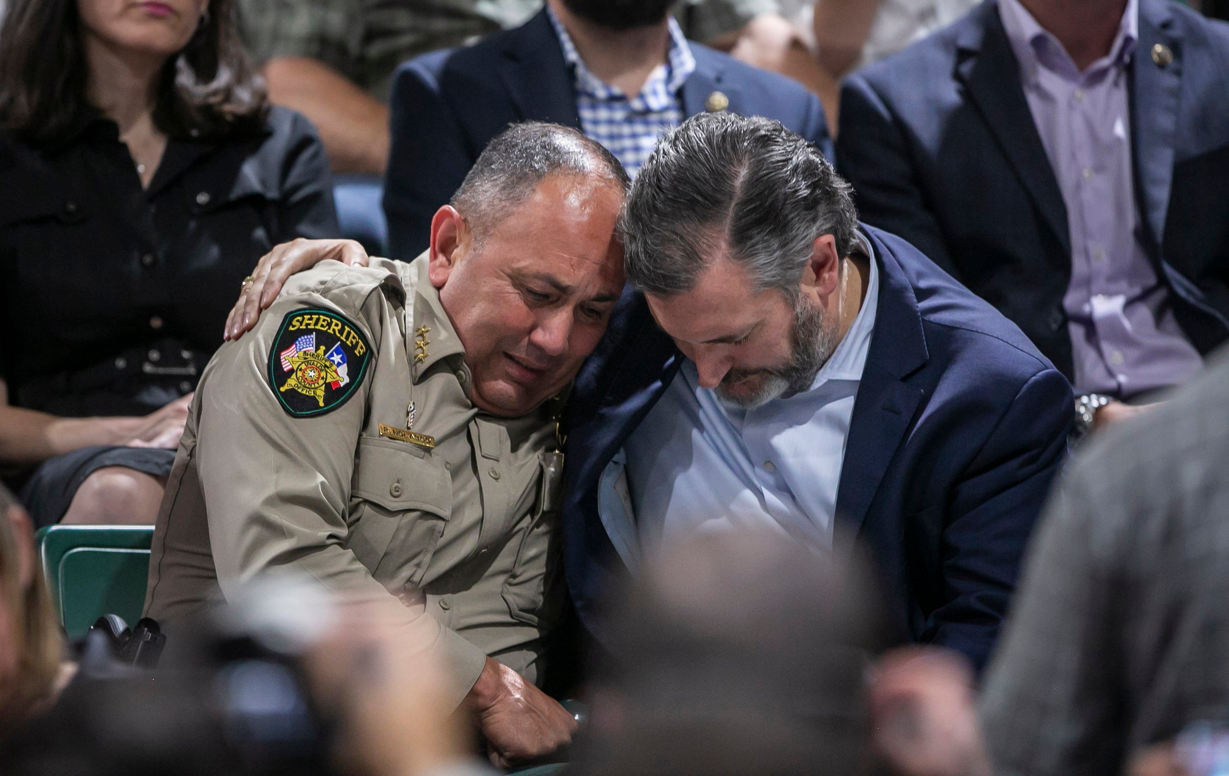 Uvalde County sheriff Ruben Nolasco, left, is comforted by US senator Ted Cruz during a vigil held in honor of those who died in the shooting