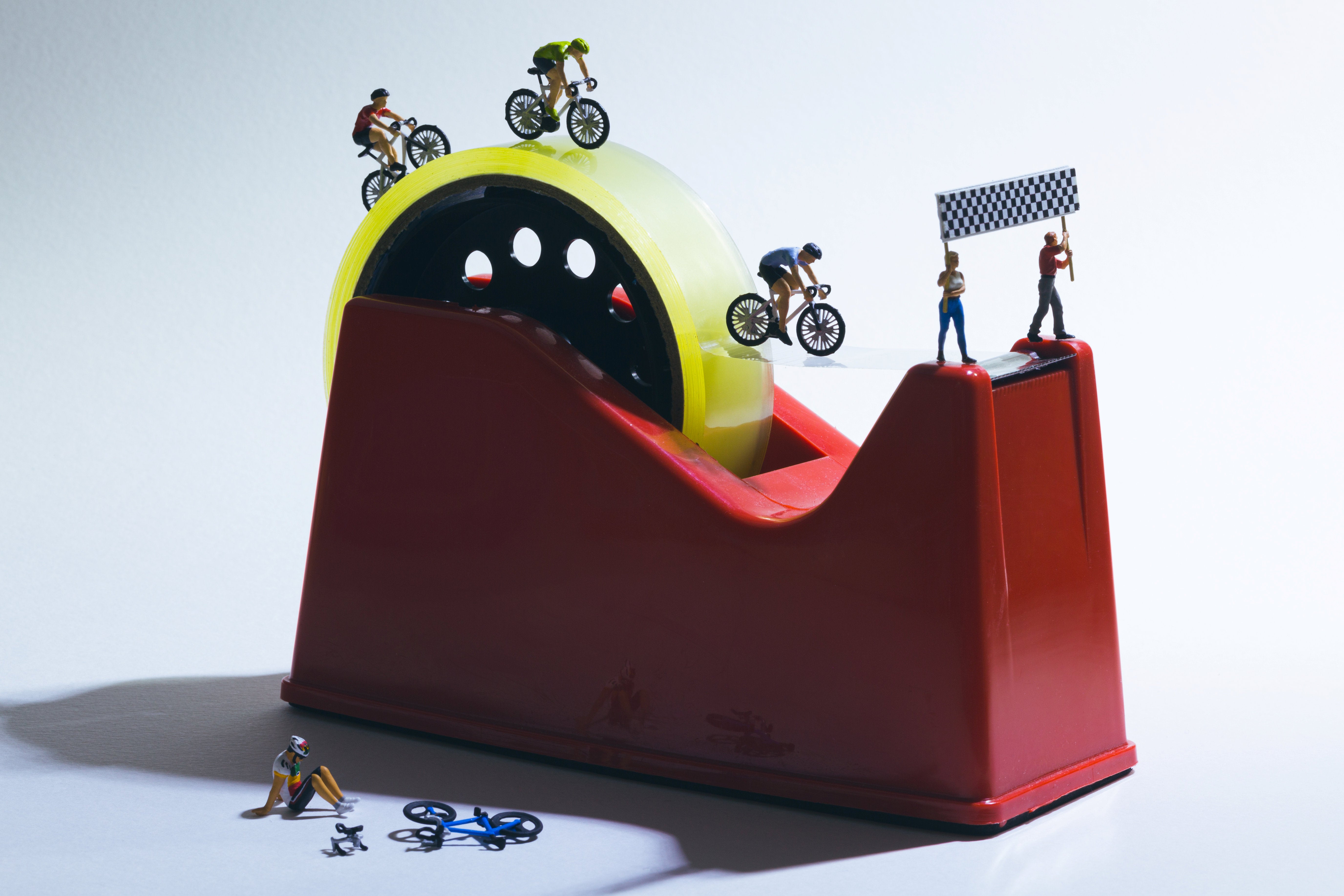 A cycle race over a tape dispenser