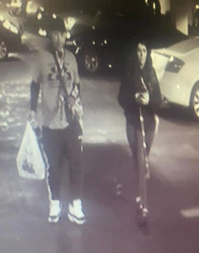Anastasia Hamilton, 25, is seen in surveillance camera footage from the parking garage at her office in downtown Cleveland with an unknown man on 21 May.