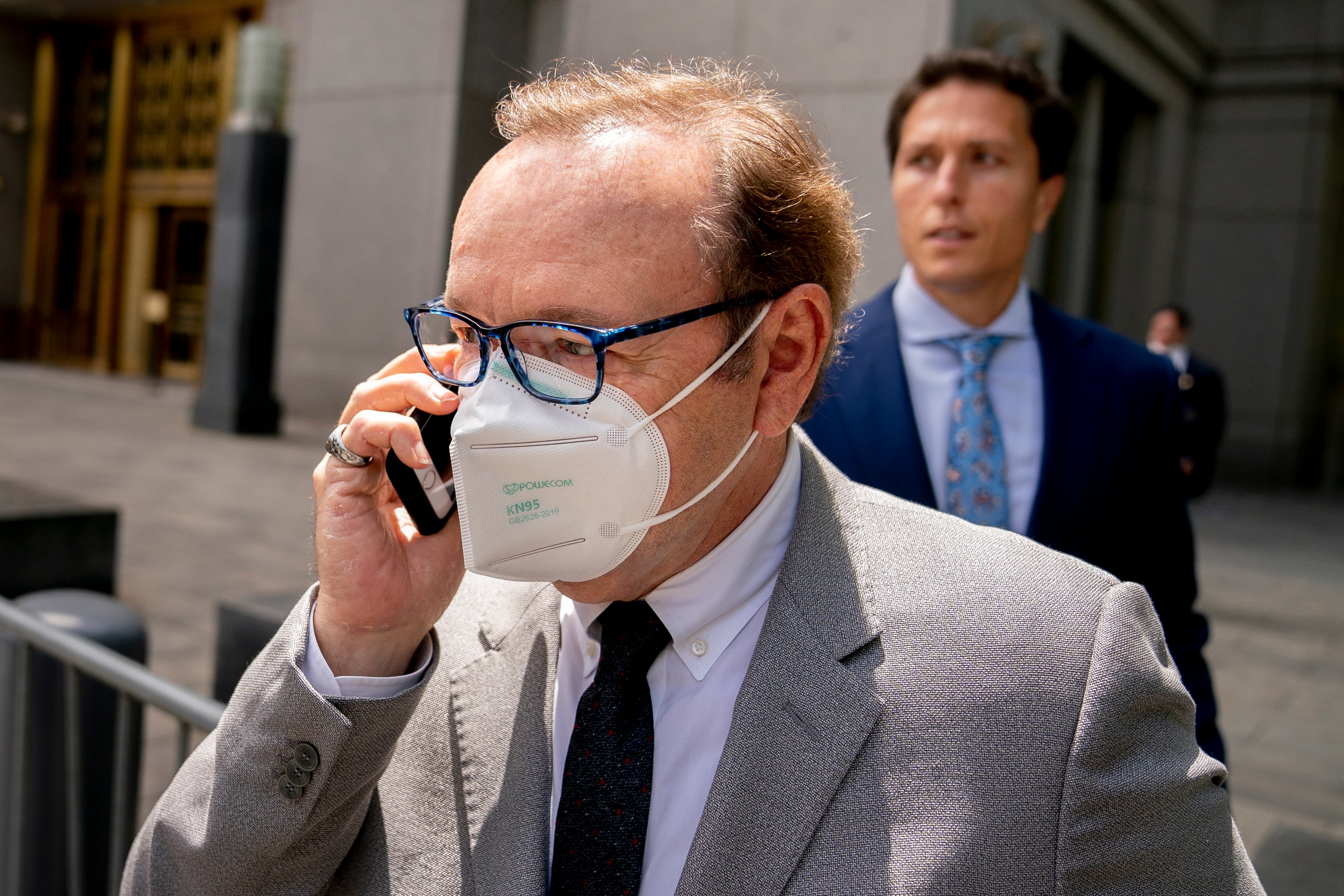 Kevin Spacey leaves court after testifying in a civil lawsuit on May 26, 2022, in New York. British prosecutors have charged Spacey with four counts of sexual assault against three men. The 62-year-old double Academy Award winner was questioned by British police in 2019 about claims by several men that he had assaulted them. The U.K. charges were announced Thursday, as Spacey was testifying in a courtroom in New York City in a civil lawsuit. (AP Photo/John Minchillo)