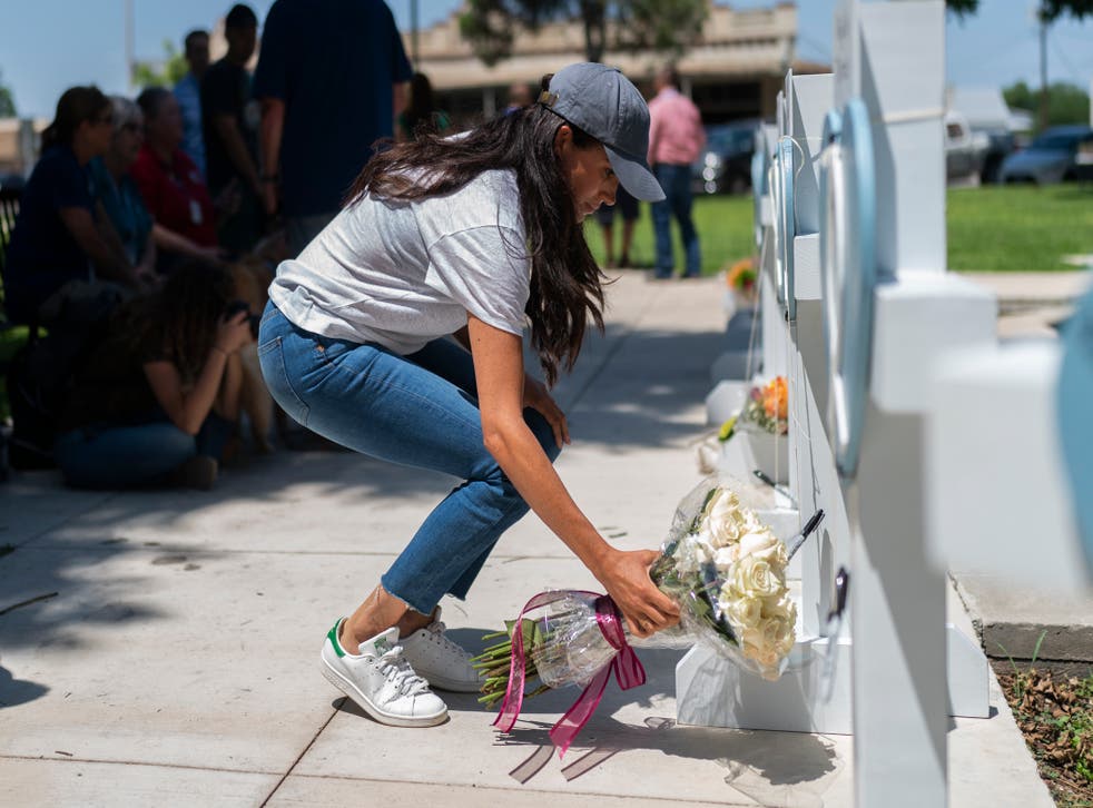 The Duchess of Sussex lays flowers at a memorial for the victims of the Texas school shooting (Jae C Hong/AP)