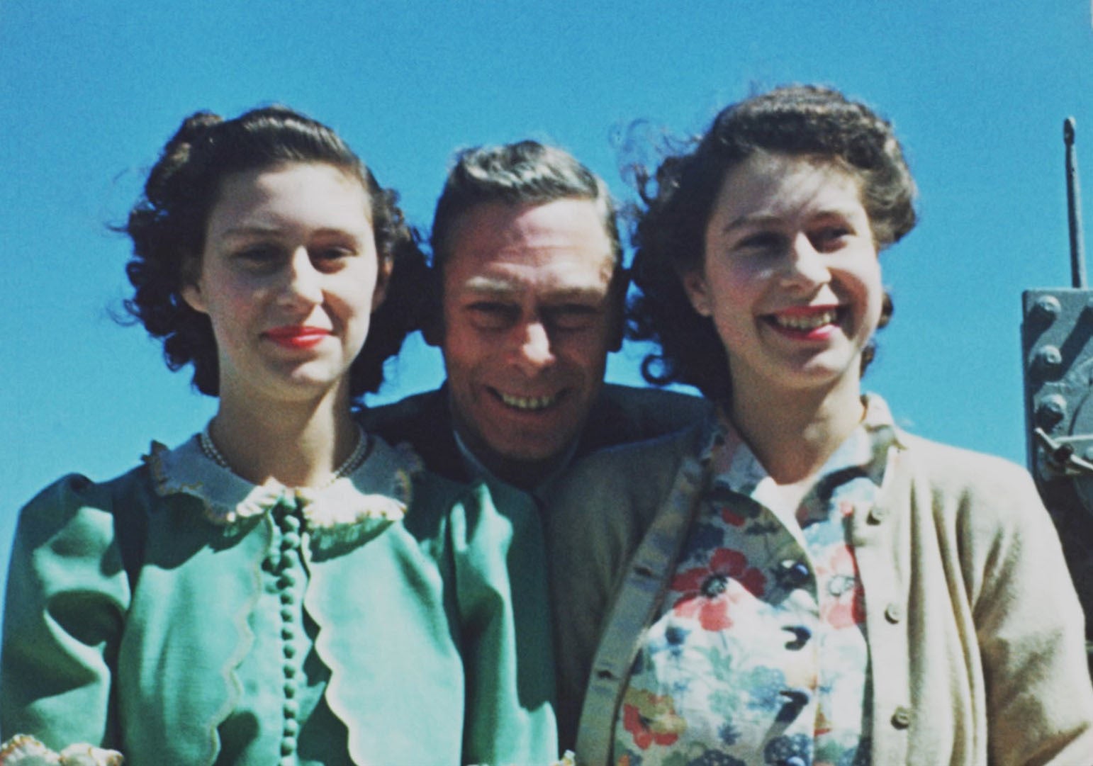 Photo from the BBC documentary, Elizabeth: The Unseen Queen of Princess Margaret and Princess Elizabeth with their beloved father King George VI onboard HMS Vanguard in 1947