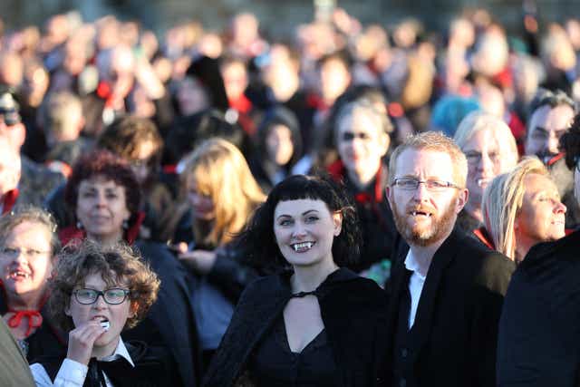 People dressed as vampires at Whitby Abbey in Yorkshire (PA)