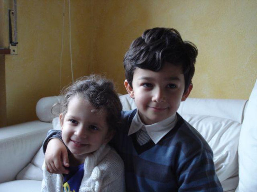Alex’s son and daughter, Michael and Maya Woolf as children at Christmas in 2009 (Collect/PA Real Life)
