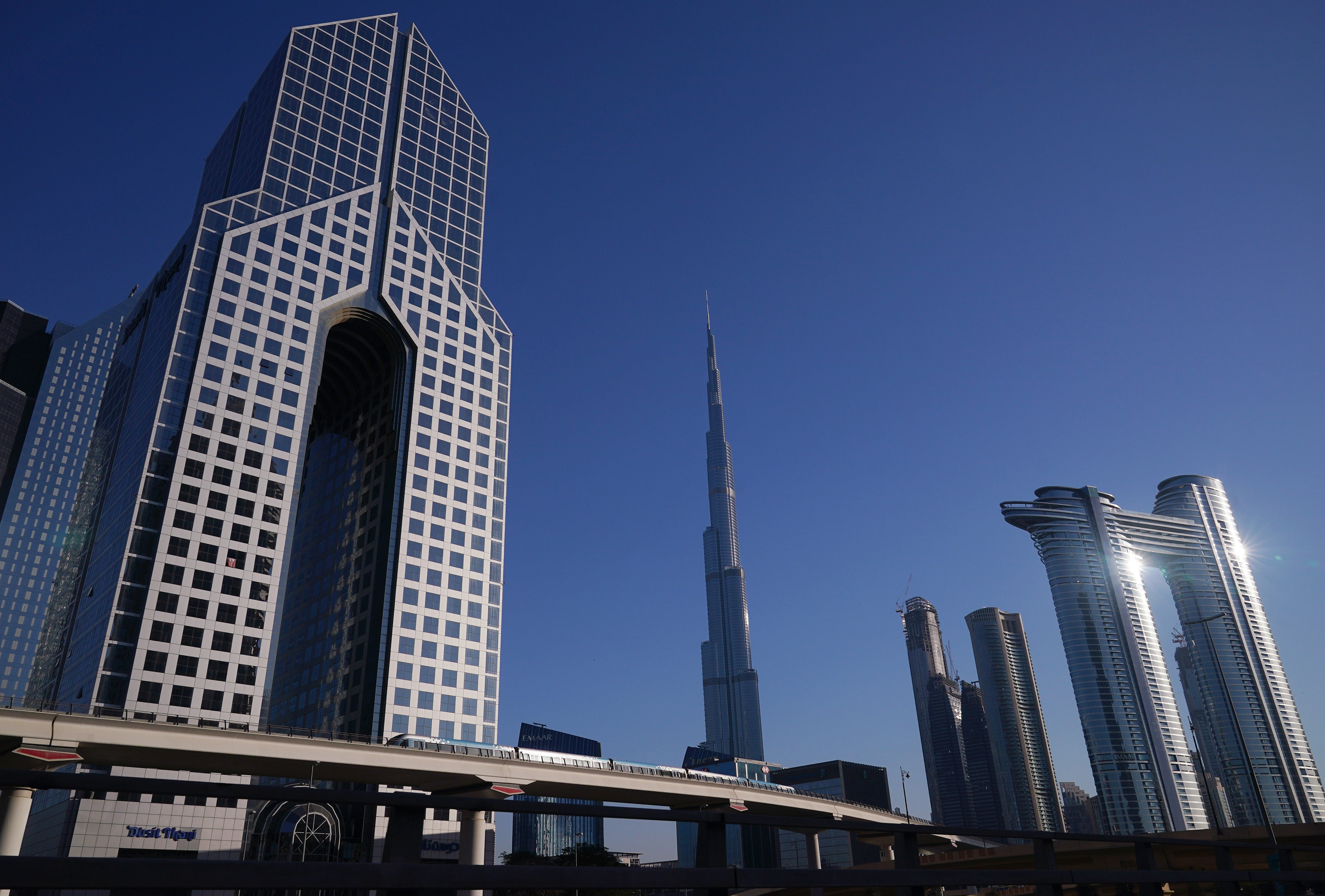 The Dusit Thani Dubai hotel (left), the Burj Khalifa skyscraper and The Address Sky View Towers (far right), part of the skyline of Dubai (Yui Mok/PA)