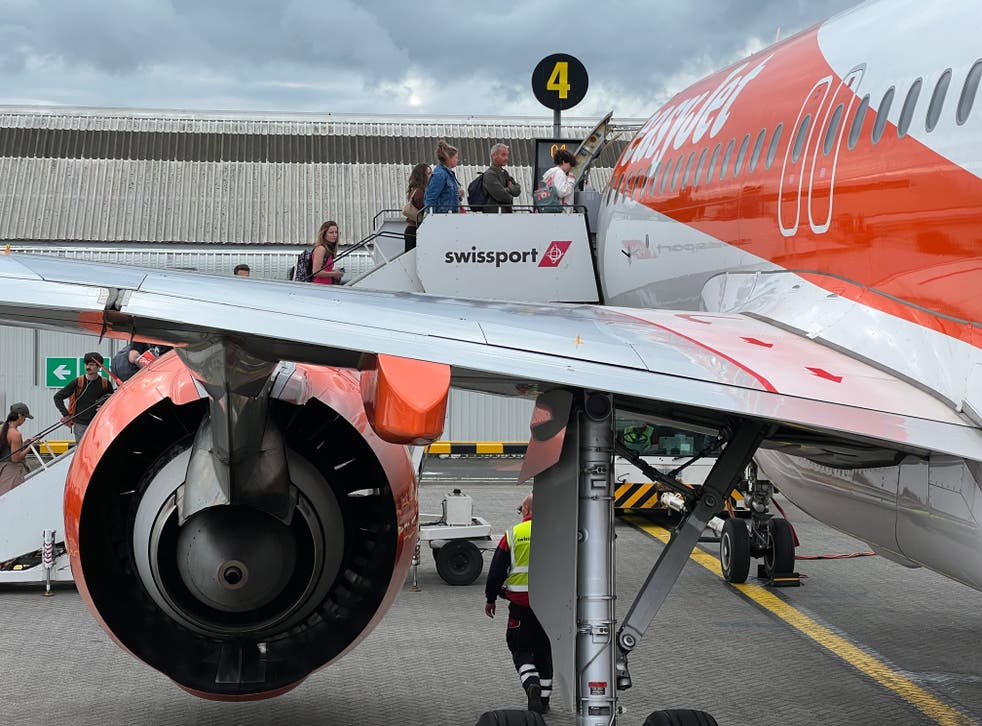 <p>Going places? Passengers boarding an easyJet Airbus A320</p>
