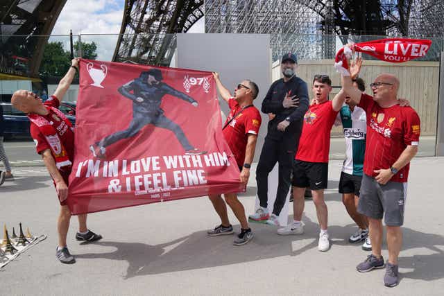 Liverpool fans near the Eiffel Tower in Paris ahead of Saturday’s Uefa Champions League final between Liverpool FC and Real Madrid at the Stade de France (Jacob King/PA)