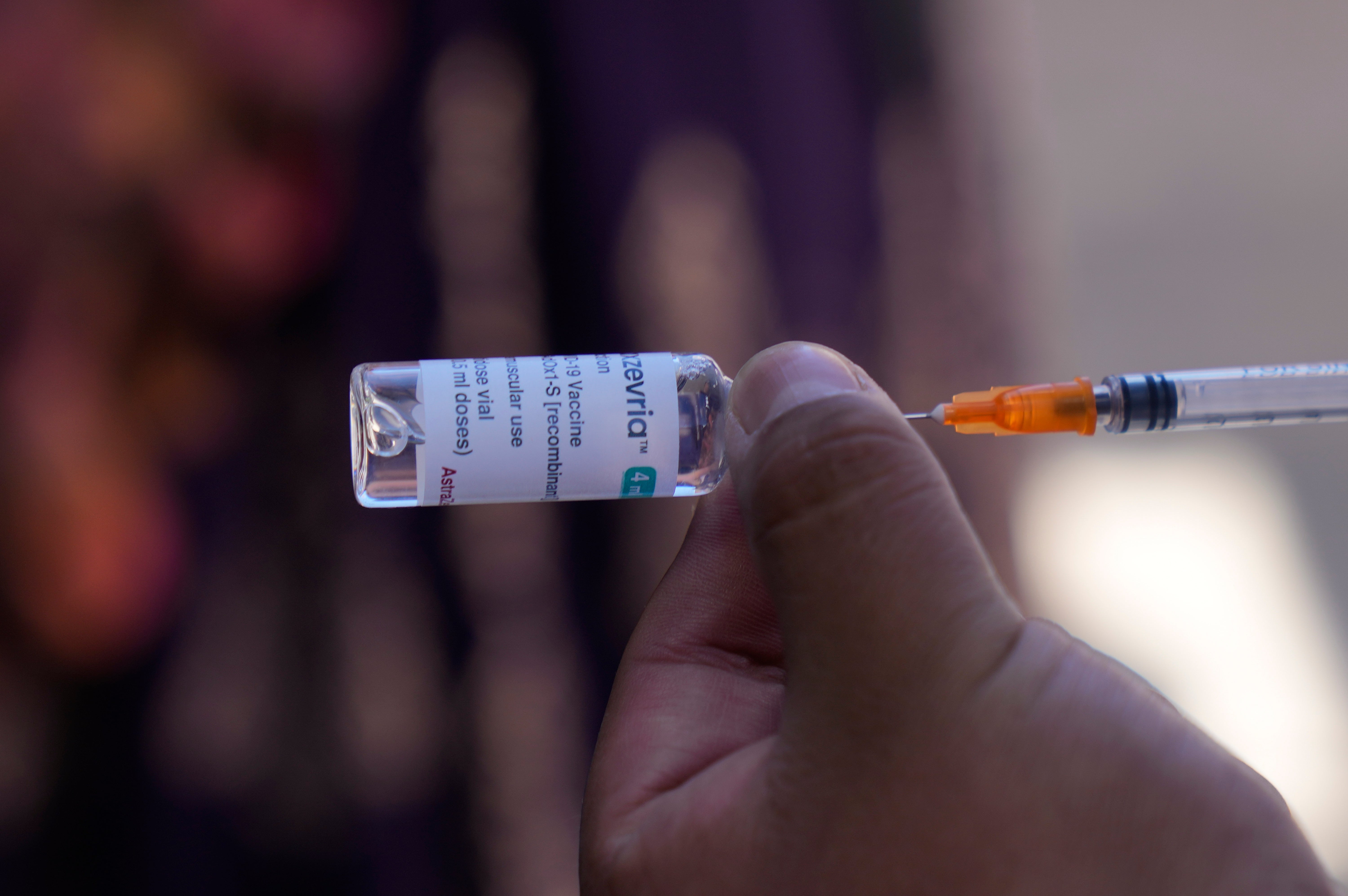 A healthcare worker prepares a dose of the AstraZeneca Covid-19 vaccine