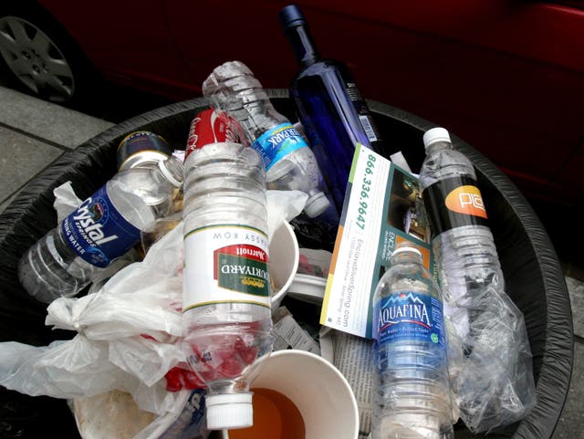 <p>Trash piles up in a Washington, DC trash can in 2008</p>