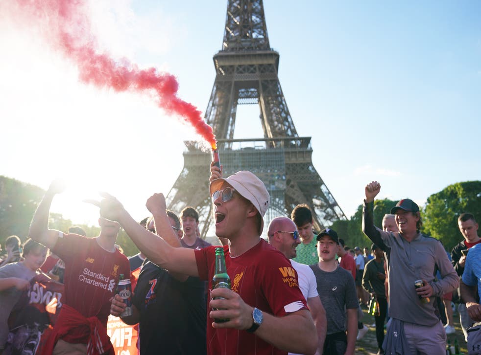 Liverpool football fans near the Eiffel Tower in Paris ahead of Saturday’s Uefa Champions League Final between Liverpool FC and Real Madrid (Jacob King/PA)