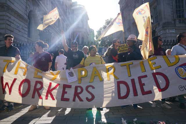Cleaners stage a protest outside Downing Street in London, following revelations in Sue Gray’s report into parties in Whitehall during the coronavirus lockdown (Jonathan Brady/PA)
