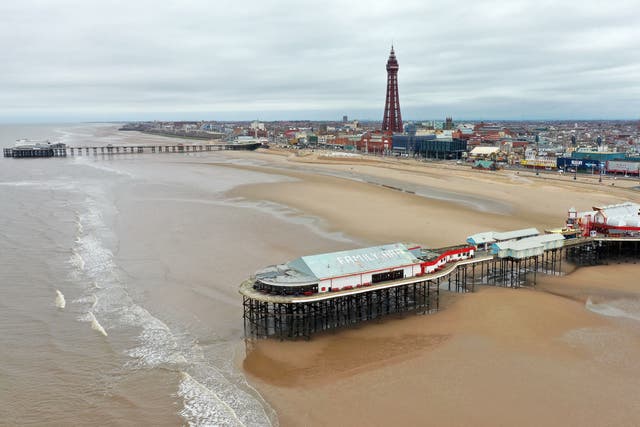 <p>An aerial photo shows of Blackpool Tower and the beachfront</p>