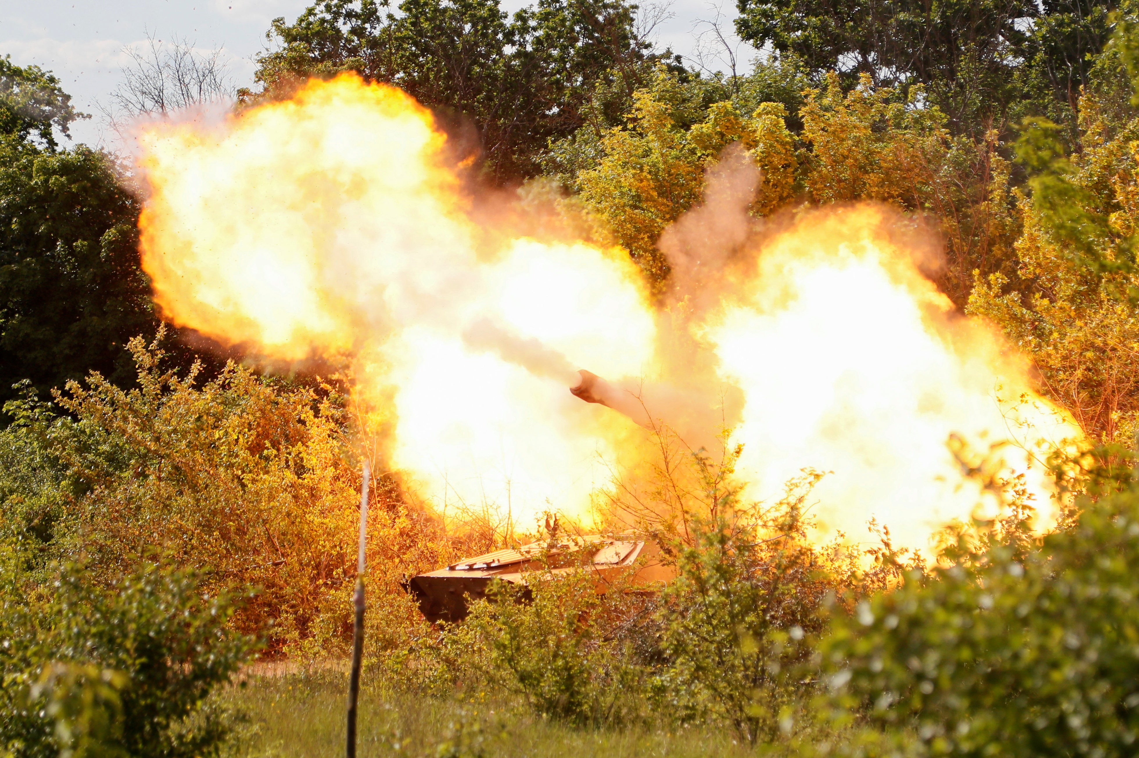 A self-propelled howitzer 2S1 Gvozdika tank of pro-Russian troops fires a shell in the direction of Sievierodonetsk