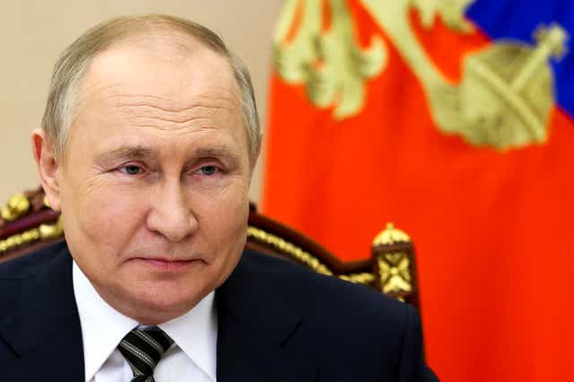 <p>Vladimir Putin attends a meeting via videoconference in Moscow</p>