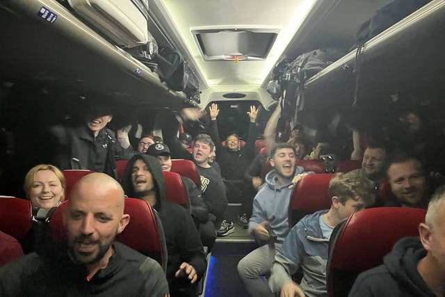 Liverpool fans in the coach provided by Simon Wilson (Simon Wilson/PA)