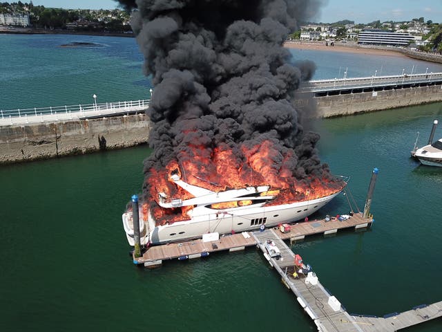 <p>Superyacht fire as £6 million boat goes up in flames and ‘explosions’ heard at Torquay harbour</p>