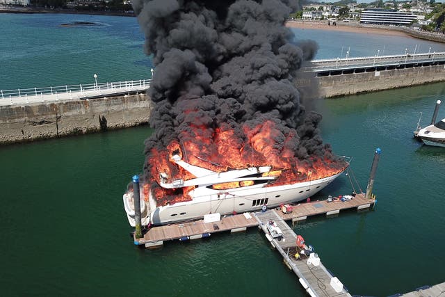 <p>Superyacht fire as £6 million boat goes up in flames and ‘explosions’ heard at Torquay harbour</p>