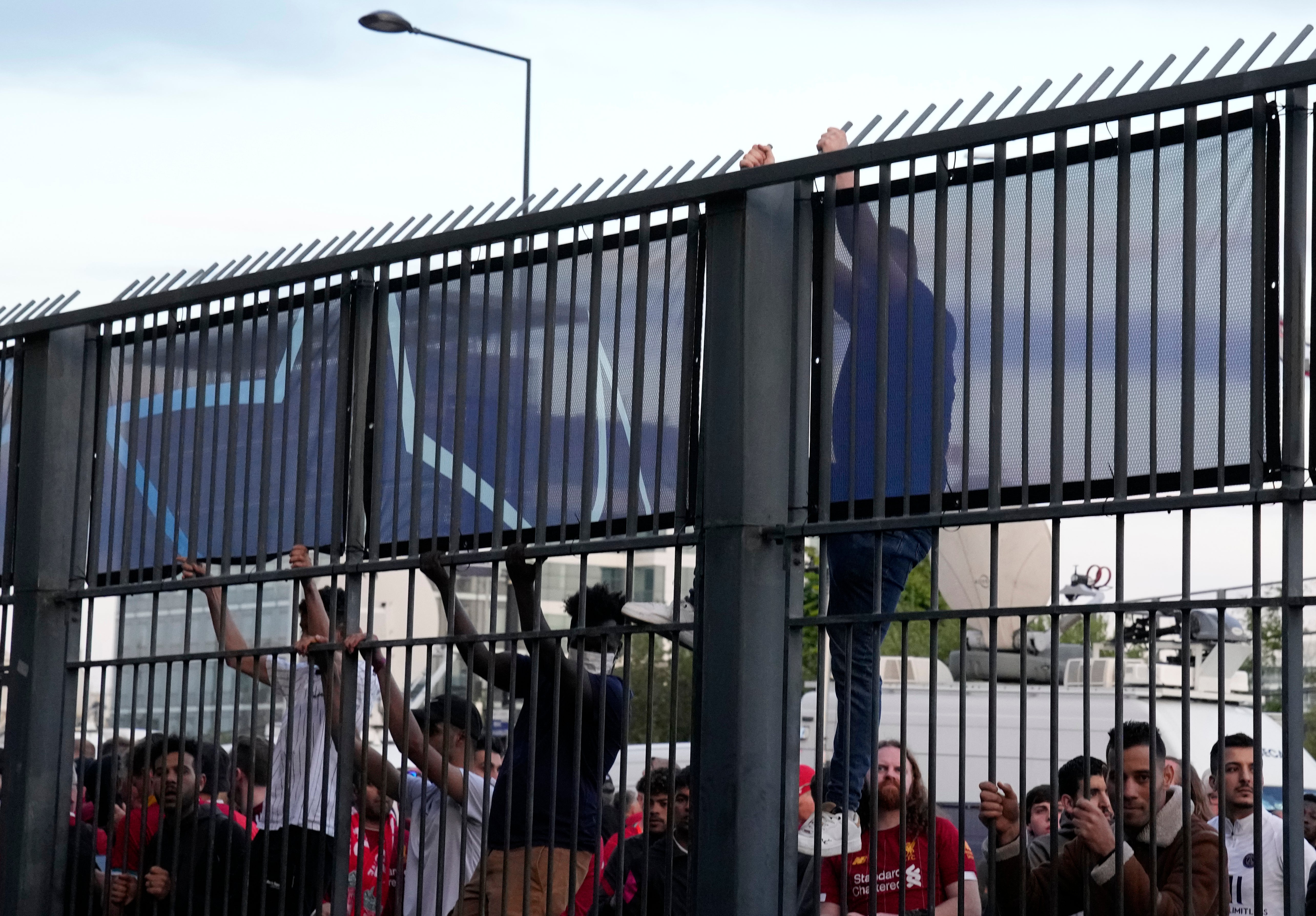 Some fans were spotted trying to climb the security fence