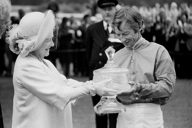 <p>Lester Piggott receiving the Ritz Club trophy from the Queen Mother in 1981</p>