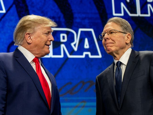 <p>Donald Trump and Wayne LaPierre at the National Rifle Association’s annual meeting In Houston</p>
