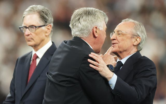 <p>Carlo Ancelotti celebrates with Florentino Perez</p>