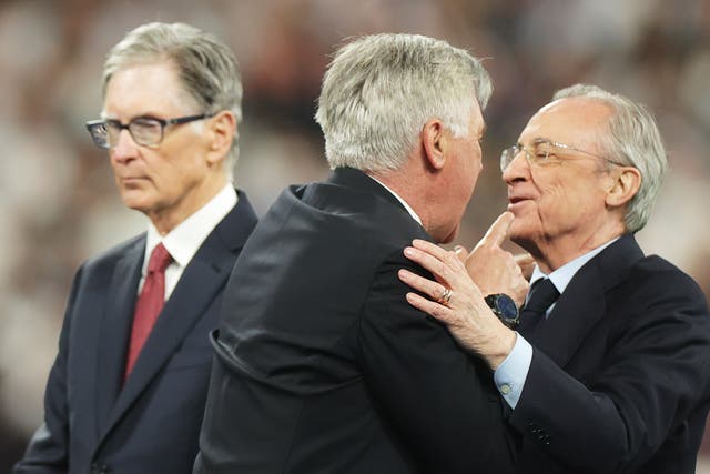 <p>Carlo Ancelotti celebrates with Florentino Perez</p>