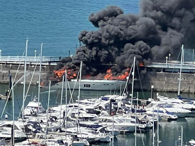 <p>A superyacht which went up in flames while moored in a marina in Torquay (Tania Coatham/Twitter/PA)</p>